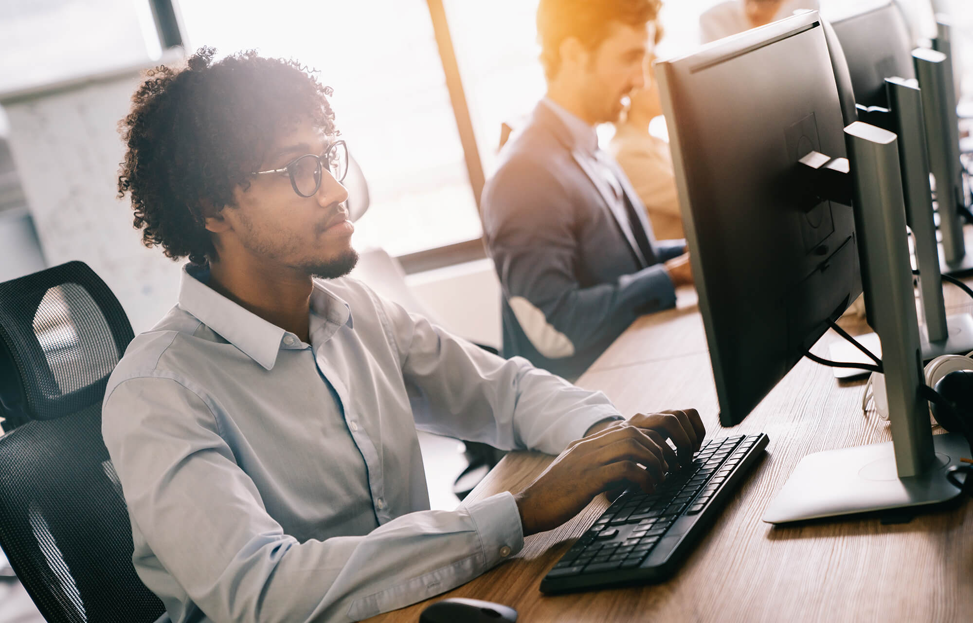 Software engineers working on project and programming in company